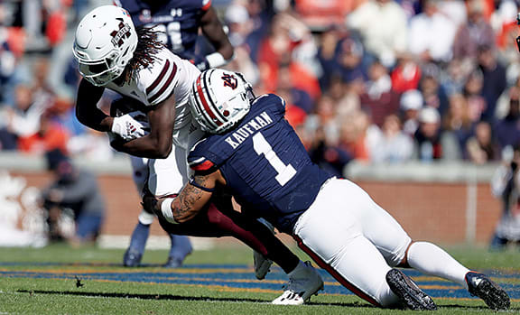 Mississippi State Bulldogs wide receiver Jaden Walley (11) is tackled by Auburn Tigers safety Donovan Kaufman (1) during the first quarter at Jordan-Hare Stadium.